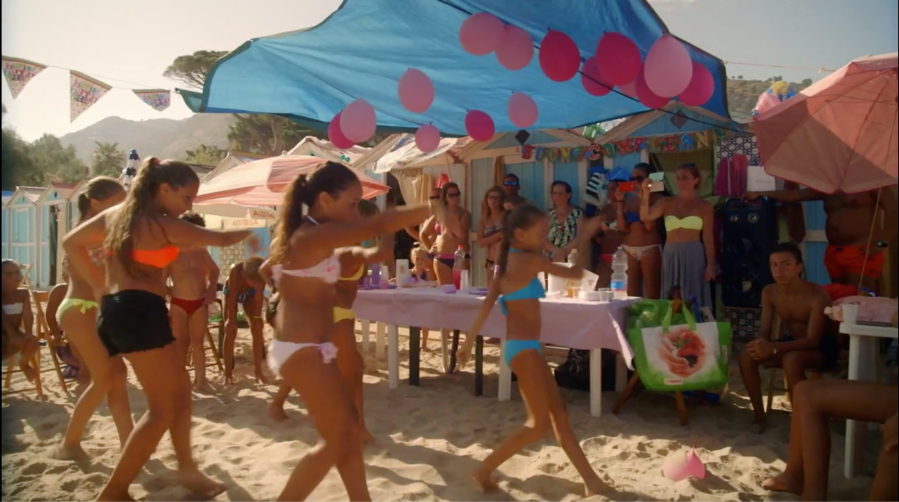 A group of girls dancing a choreographed routine to Gruppo Italiano’s song Tropicana in Happy Winter