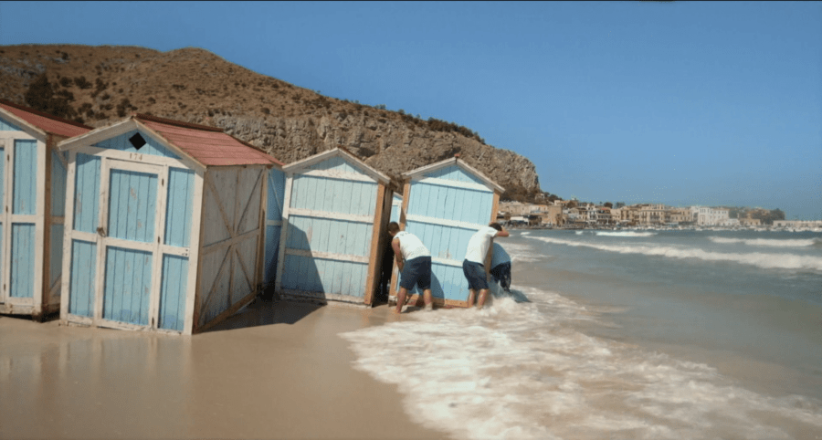 A heavy storm floods the beach, prompting an evacuation to higher ground in Happy Winter