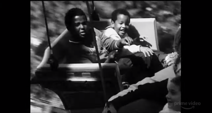 2 kids enjoying a ride at an amusement park in Garret Bradley's Time