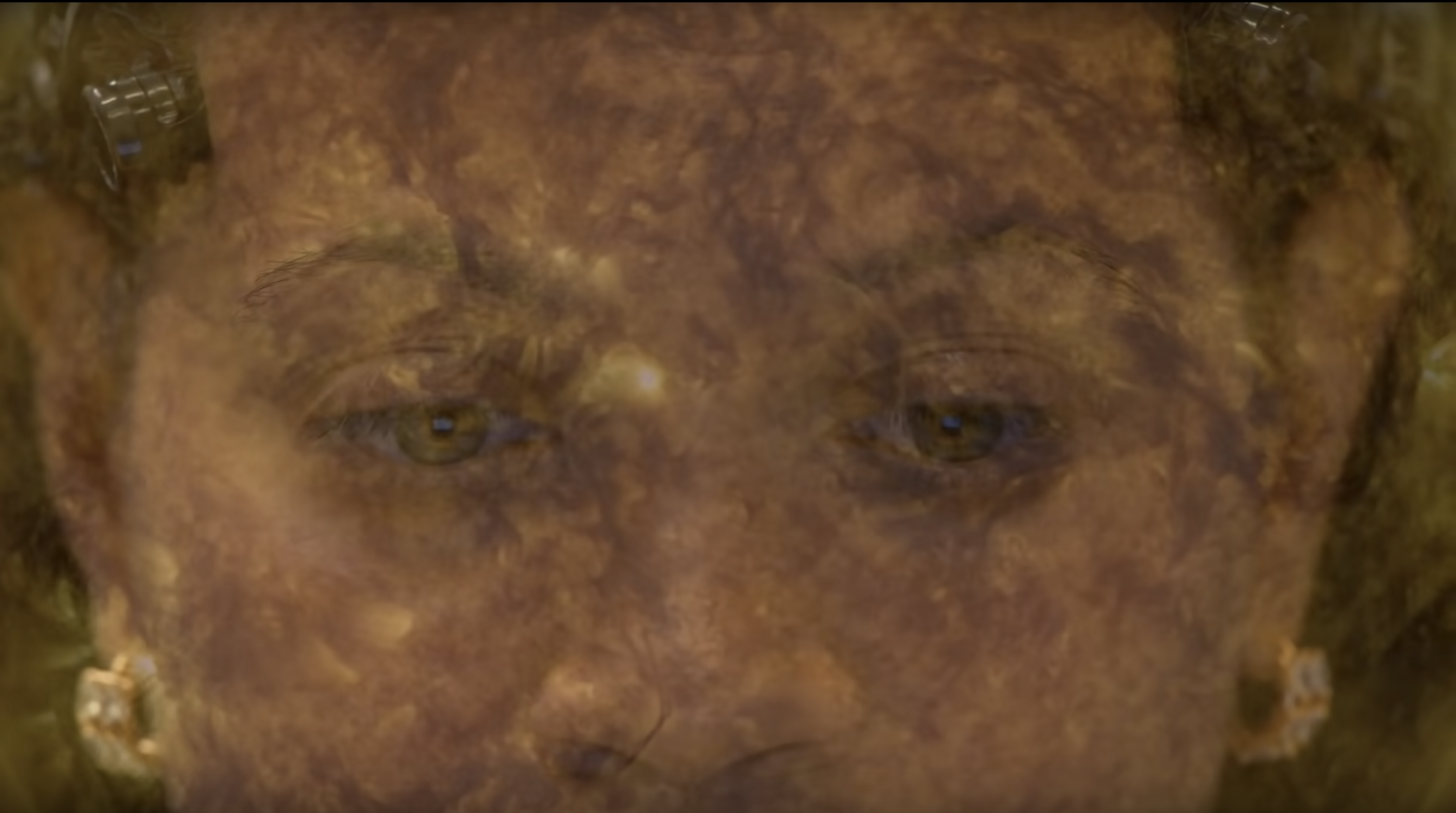 Light filtering over a woman's face, in close up