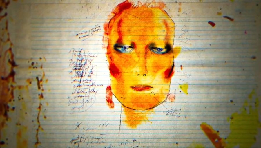 a sketch of an andorgynous head, painted in reds and yellows