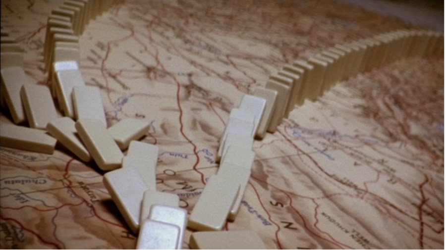 close up of dominoes falling over a